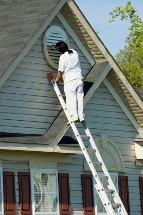 Exterior Painting being performed by an experienced Ocean Blue Painting And Furniture Restoration, Inc. painter.